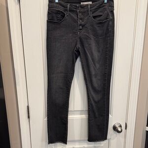 Levi's Mid Rise Black Jeans for Women, with button fly.